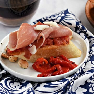 Toasted bread topped with grated ripe tomato, jamon, and manchego cheese.