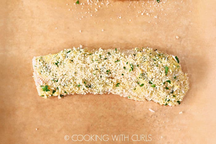 Panko-Crusted Cod on a parchment lined baking sheet. 