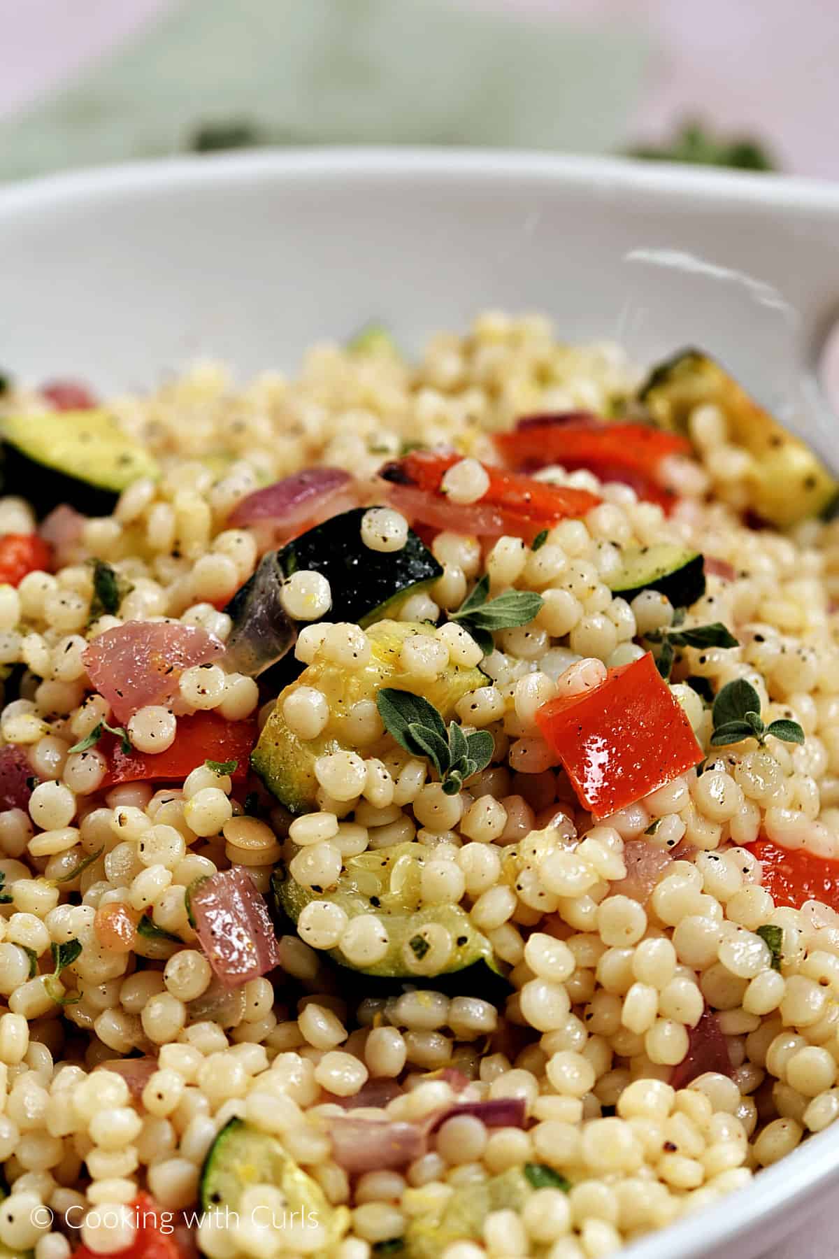 Pearl Couscous with Roasted Vegetables in a serving bowl. 