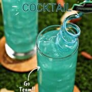 Looking down into a teal green Philadelphia eagles cocktail with spiral straw and title graphic across the top.