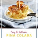 A scoop of pina colada bread pudding on a small white plate with coconut cream glaze drizzled down and a pan of bread pudding in the background with title graphic across the bottom.