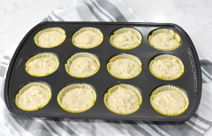Pina Colada Muffins batter in 12 paper liner filled baking tin. 
