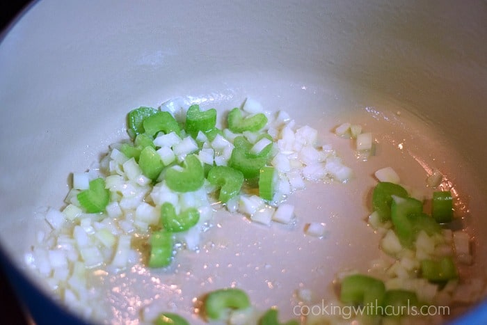 Diced onion and celery with oil in a large Dutch oven.
