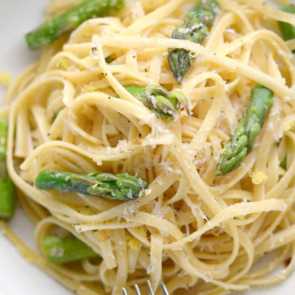 a close-up look at a big bowl of asparagus lemon pasta.