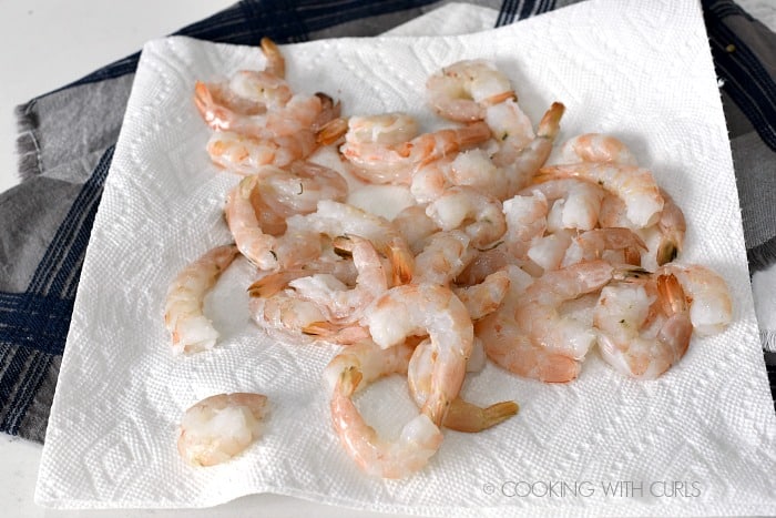 Raw shrimp drying on a paper towel 