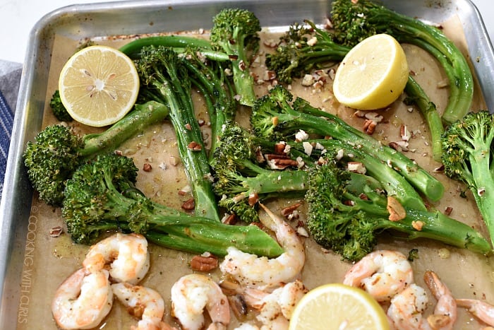 Roasted broccolini with lemon vinaigrette and chopped walnuts on the sheet pan 