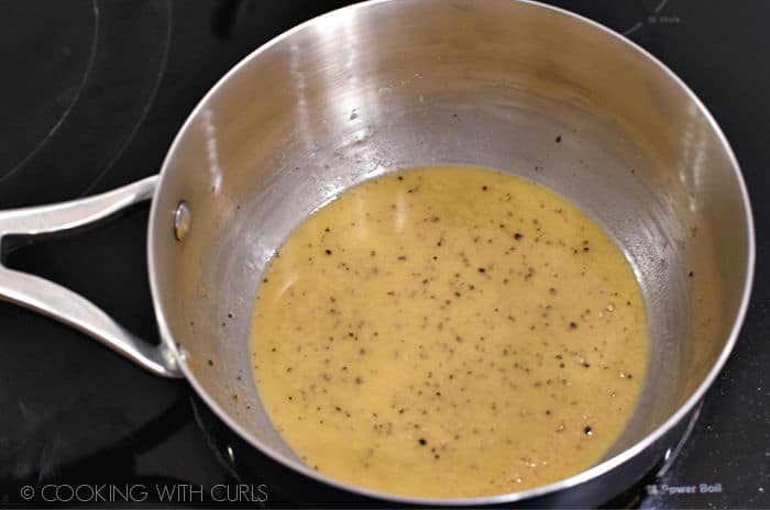 roux getting darker as it simmers in the saucepan. 