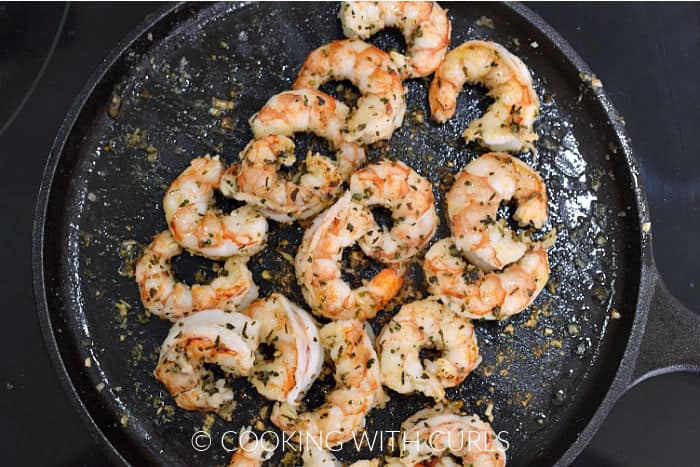 Seasoned shrimp cooked on a cast iron griddle. 