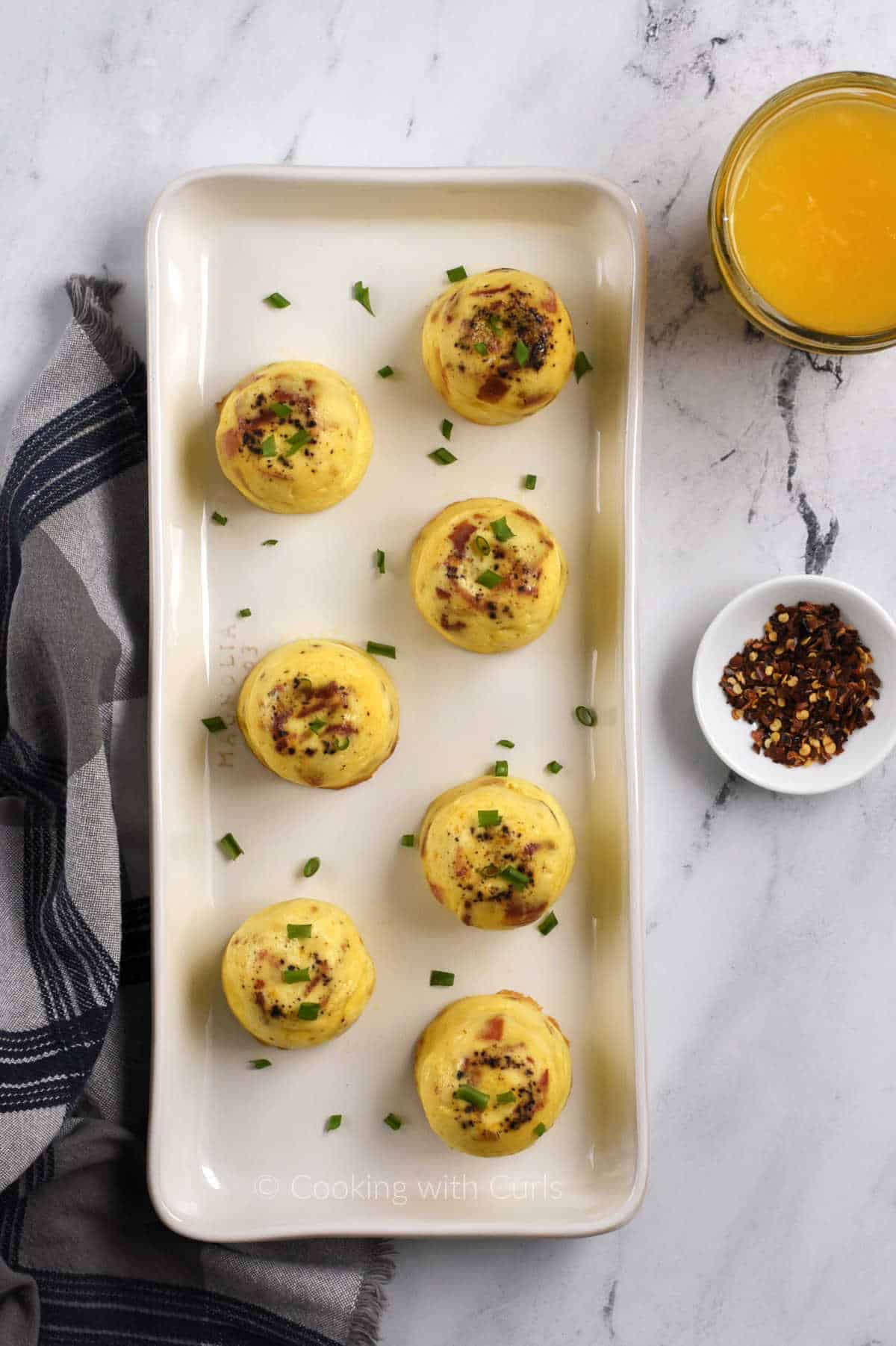 Seven-instant-pot-bacon-cheddar-egg-bites-on-a-platter.