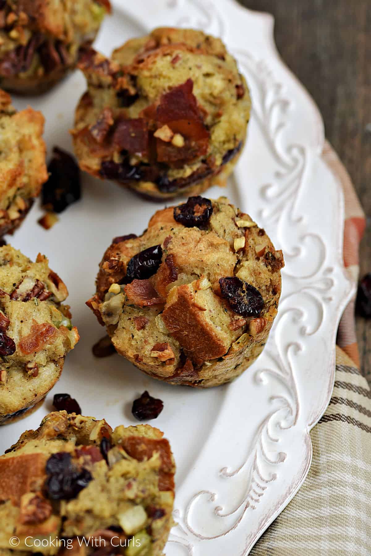 Six stuffing muffins recipe on a white serving platter.