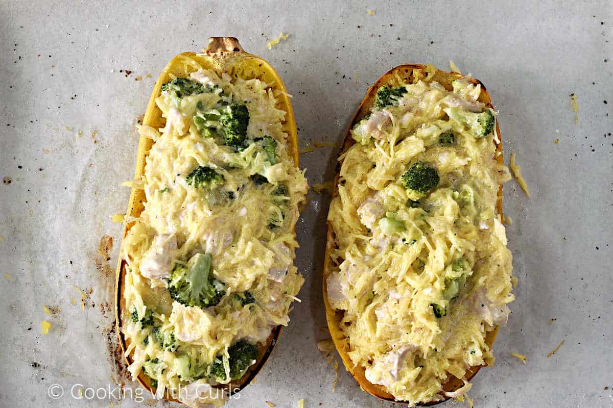 Spaghetti squash shells filled with chicken broccoli alfredo mixture.