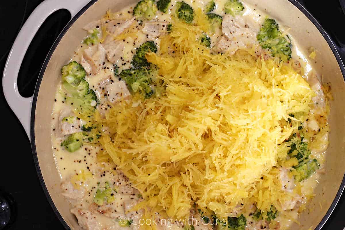 Spaghetti squash strands added to chicken broccoli alfredo sauce.