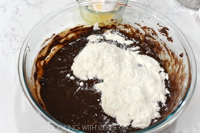 Stir the flour into the chocolate mixture cookingwithcurls.com