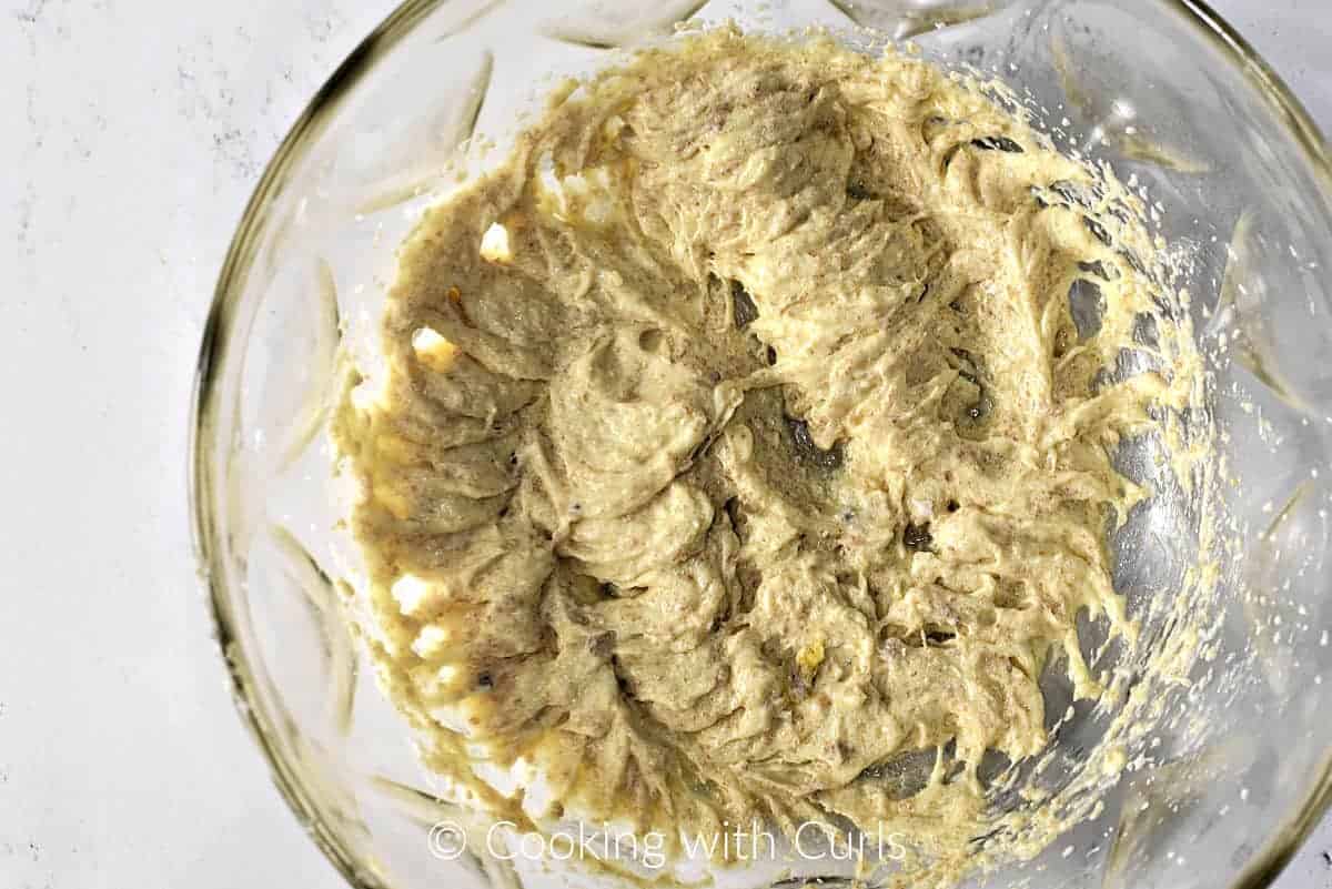 Sugar, lard, eggs, and almond flavor beaten together in a large bowl. 