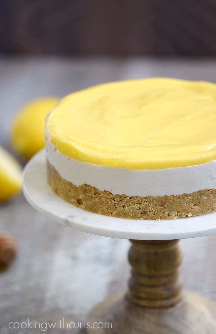 The only thing missing from this rich and creamy Paleo Lemon Cheesecake is the calories! cookingwithcurls.com #feastndevour