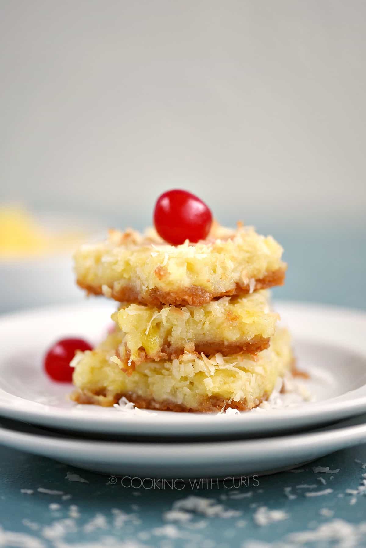 Three Pina Colada Bars stacked on two white plates