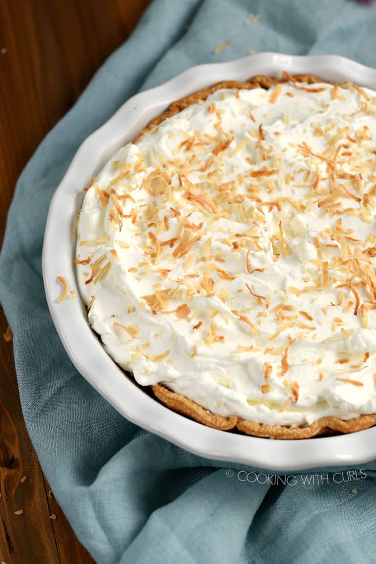 Looking down on a whole Pina Colada Pie topped with toasted coconut