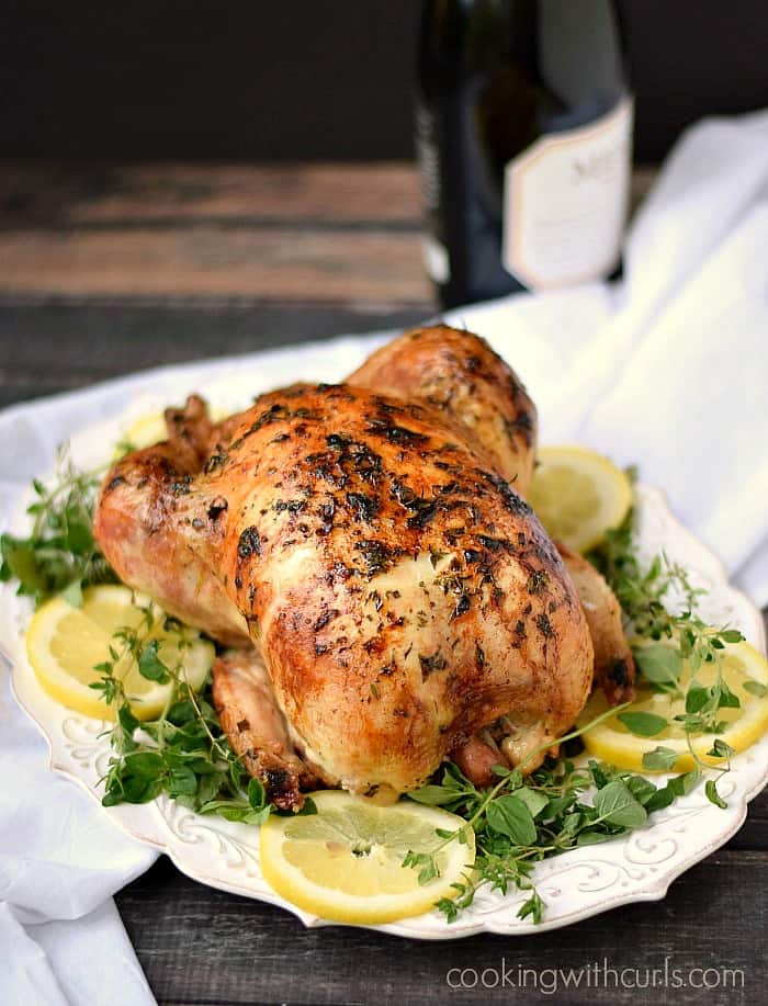 This Greek Roasted Chicken is tender and flavorful on the inside and crispy on the outside! cookingwithcurls.com