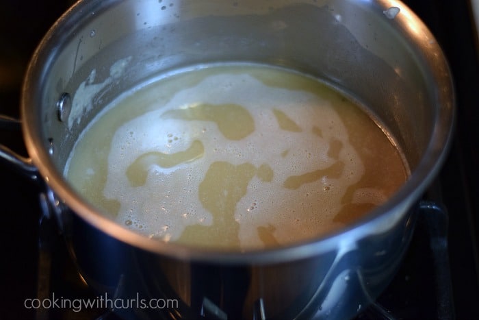 stock added to the roux in a saucepan.