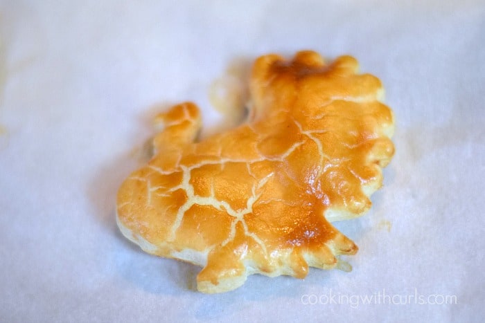 Baked turkey cookie on parchment paper.