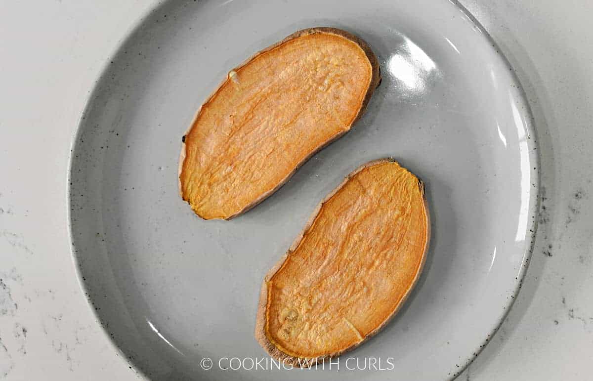 Two slices of sweet potato toast on a small plate.