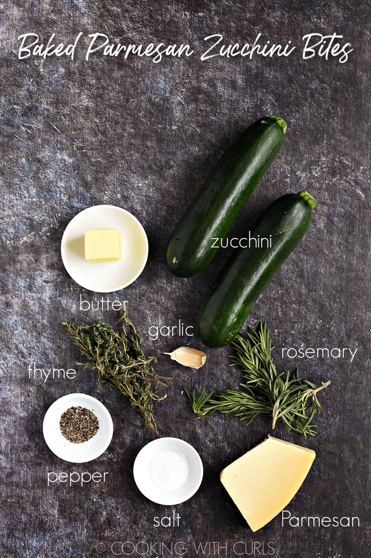 Two zucchini, butter, garlic, rosemary, thyme, Parmesan, salt and pepper on a rustic background.