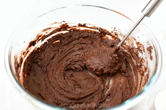 Whisk the powdered sugar into the melted chocolate cookingwithcurls.com