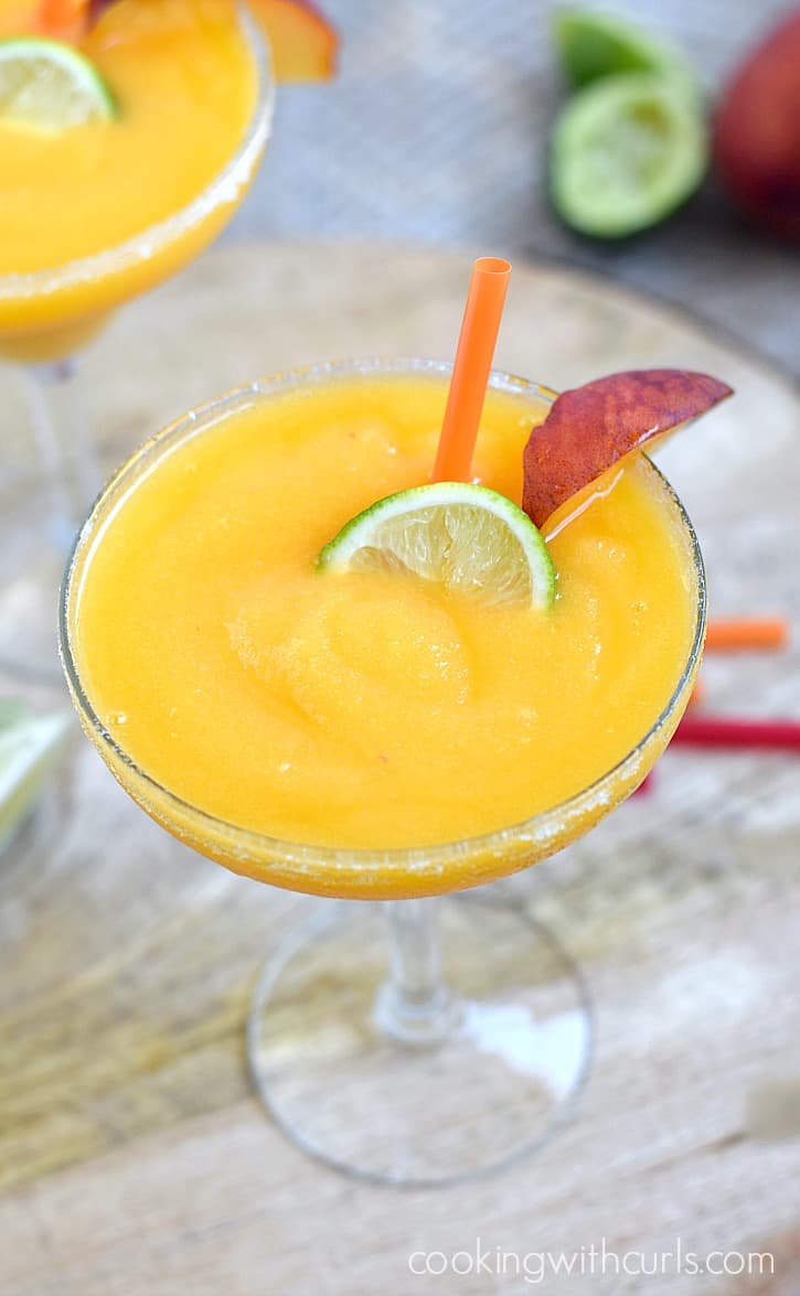 Your next fiesta needs a few of these delicious Frozen Peach Margaritas | cookingwithcurls.com