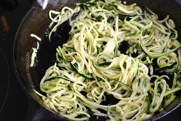 Zucchini noodles in a cast iron skillet